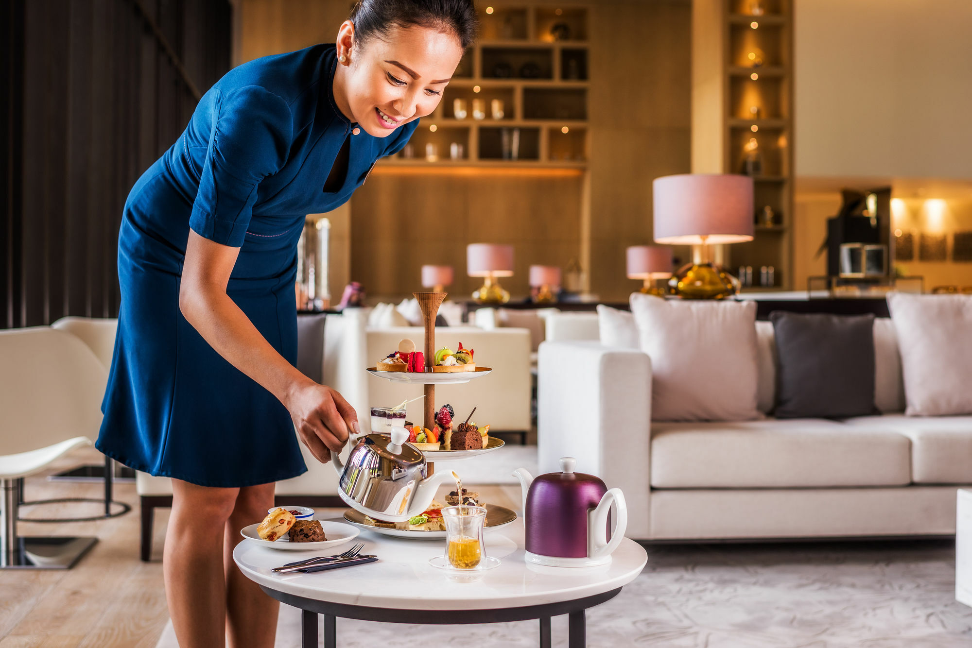 La Ville Hotel & Suites City Walk Dubai, Autograph Collection Экстерьер фото A room service attendant serving afternoon tea at a hotel